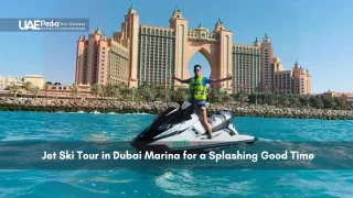 Man posing on jet ski near Atlantis Hotel in Dubai Marina