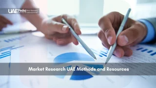 Close-up of business hands analyzing pie charts and graphs on paper