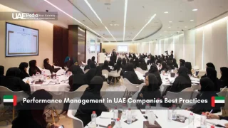 Professionals attending a performance management meeting in UAE.