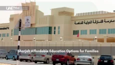 Exterior of a private school building in Sharjah with parked cars