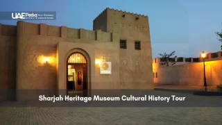 Traditional Sharjah heritage museum building lit at dusk