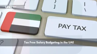 UAE flag key and "Pay Tax" button on a keyboard