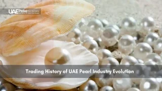 Open oyster shell with scattered natural pearls on sand