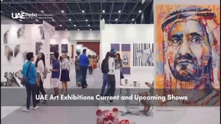 People attending an indoor UAE art exhibition