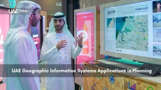 Two men interacting with a Geographic Information System screen