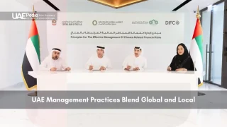UAE officials signing a document on climate-related financial risk management