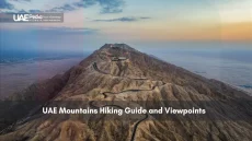 Scenic view of the UAE mountains, showing hiking trails and road access