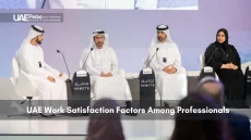 Professionals Discussing Work Satisfaction Factors in UAE
