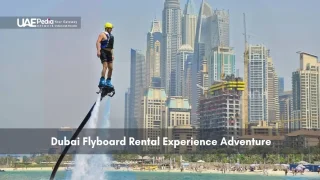 Man flyboarding over water with Dubai skyscrapers in the background