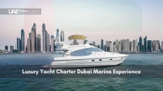 White luxury yacht cruising in front of Dubai Marina skyline