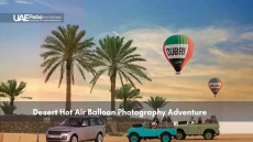 Hot air balloons over Dubai desert with palm trees and vehicles