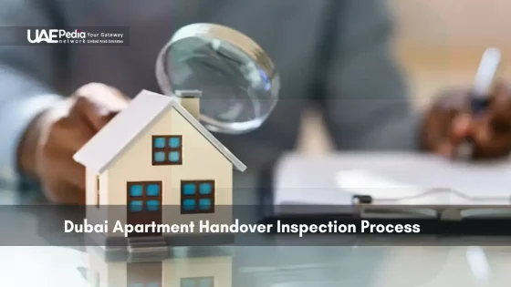 Magnifying glass examining miniature house model