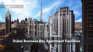 High-rise apartment buildings in Dubai Business Bay district with Burj Khalifa behind.