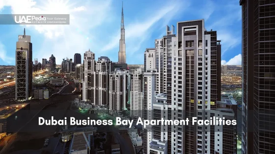 High-rise apartment buildings in Dubai Business Bay district with Burj Khalifa behind.