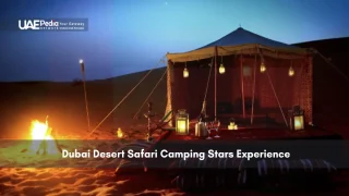 Night desert camp in Dubai with lanterns, tent and firelight