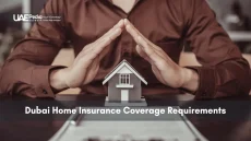 Pair of hands shaped like a roof above a tiny house model, representing home insurance protection.