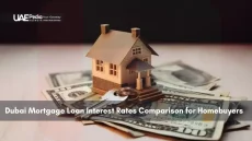 Model house and keys on US dollar bills