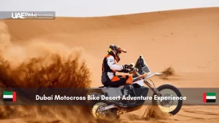 Motorcyclist riding off-road bike in desert sand