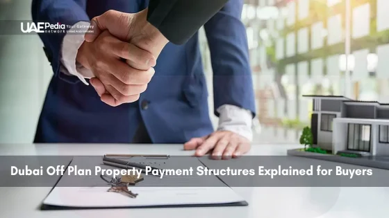 Business handshake near house model and contract showing off-plan payment deals