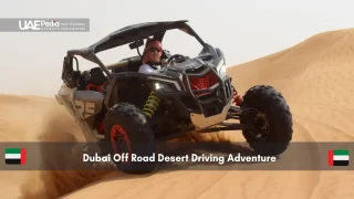 Off road vehicle driving through Dubai desert dunes