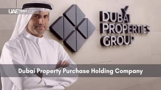 Emirati man wearing a kandura stands arms crossed in front of Dubai Properties Group logo