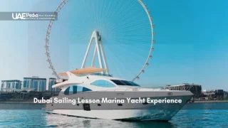 Luxury yacht in Dubai Marina with Ferris wheel in the background