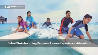 Family learning wakeboarding in the sea