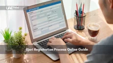 Man filling online Ejari application on laptop