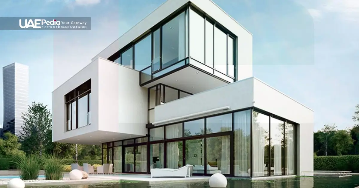 Modern villa with large glass windows and garden landscaping