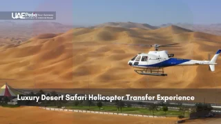 Helicopter flying over golden sand dunes in UAE desert safari