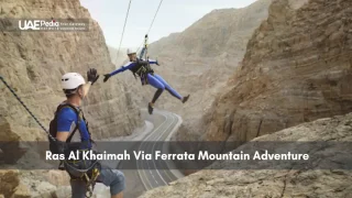 People enjoying Ras Al Khaimah Via Ferrata mountain climbing adventure