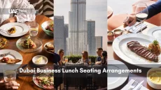 Formal business lunch with fine dishes and Burj Khalifa backdrop.