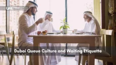 Emirati men sitting at a table, enjoying coffee and conversation.