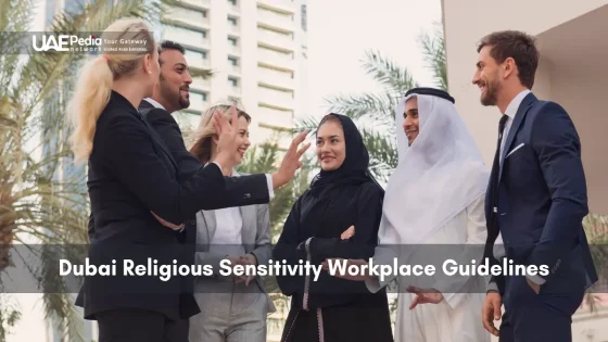 Colleagues review religious sensitivity guidelines outdoors with Dubai skyline behind.