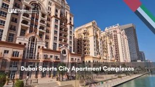 Beige Mediterranean-style apartment towers along a canal in Dubai Sports City