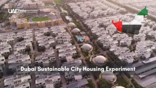 Bird’s-eye view of Dubai Sustainable City showcasing solar rooftops and housing clusters.
