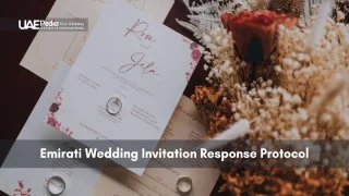 Wedding invitation cards, rings and dried flowers arranged to show Emirati RSVP protocol.