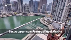 Balcony overlooking Dubai Marina with boats and high-rise buildings.