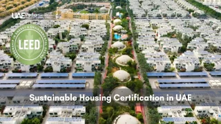 Top-down view of Emirati residential area with solar arrays and LEED emblem