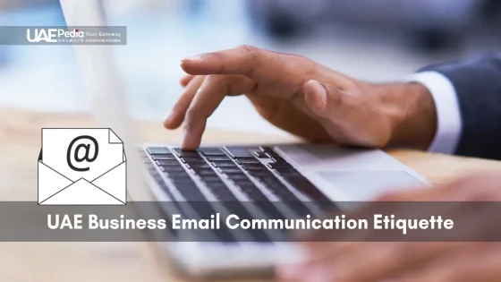 Hand of a business user typing on laptop while composing a formal email message.