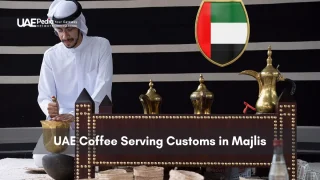 Traditional UAE majlis scene with host in kandura pouring Arabic coffee for guests.