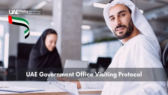 Emirati man in white thobe inside a government office.